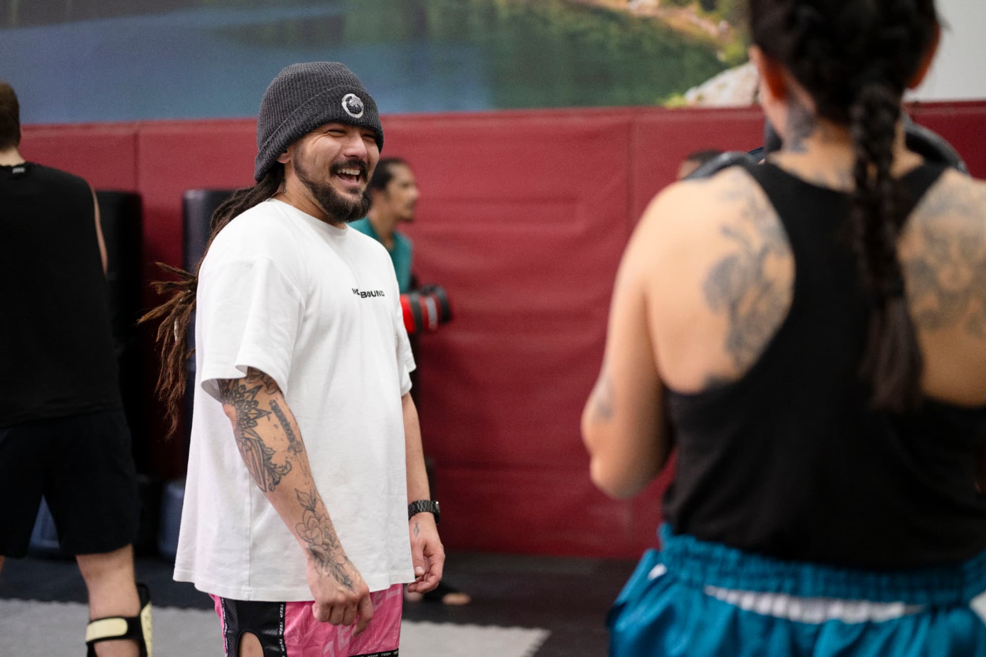 Matt sharing a relaxed moment with students at the gym